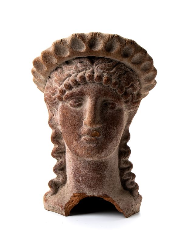 Antefissa in terracotta raffigurante testa femminile