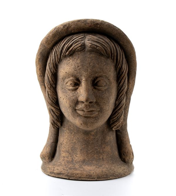 Antefissa in terracotta rappresentante testa di figura muliebre