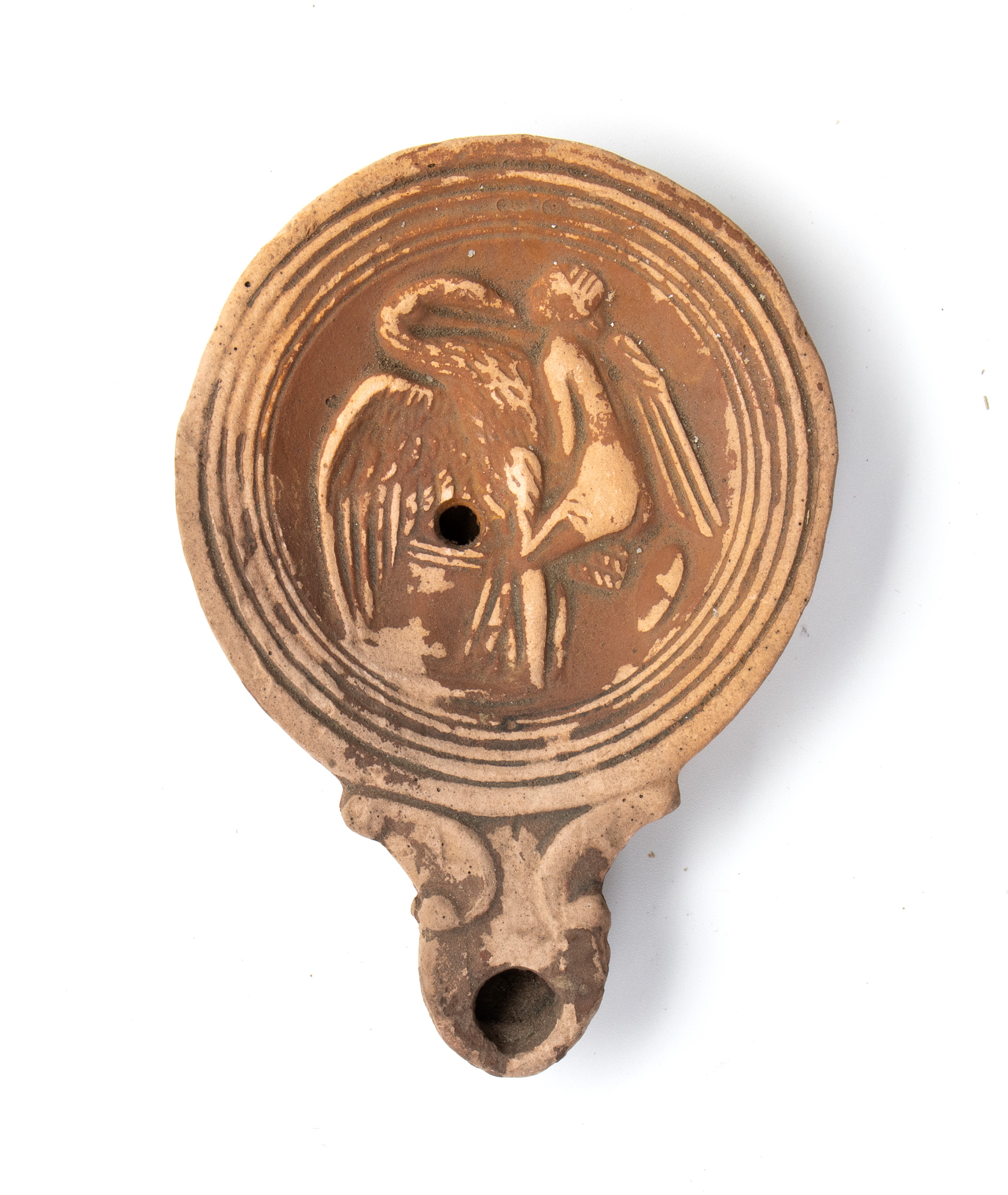 Lucerna in terracotta con al centro rilievo raffigurante il mito Leda e il cigno
