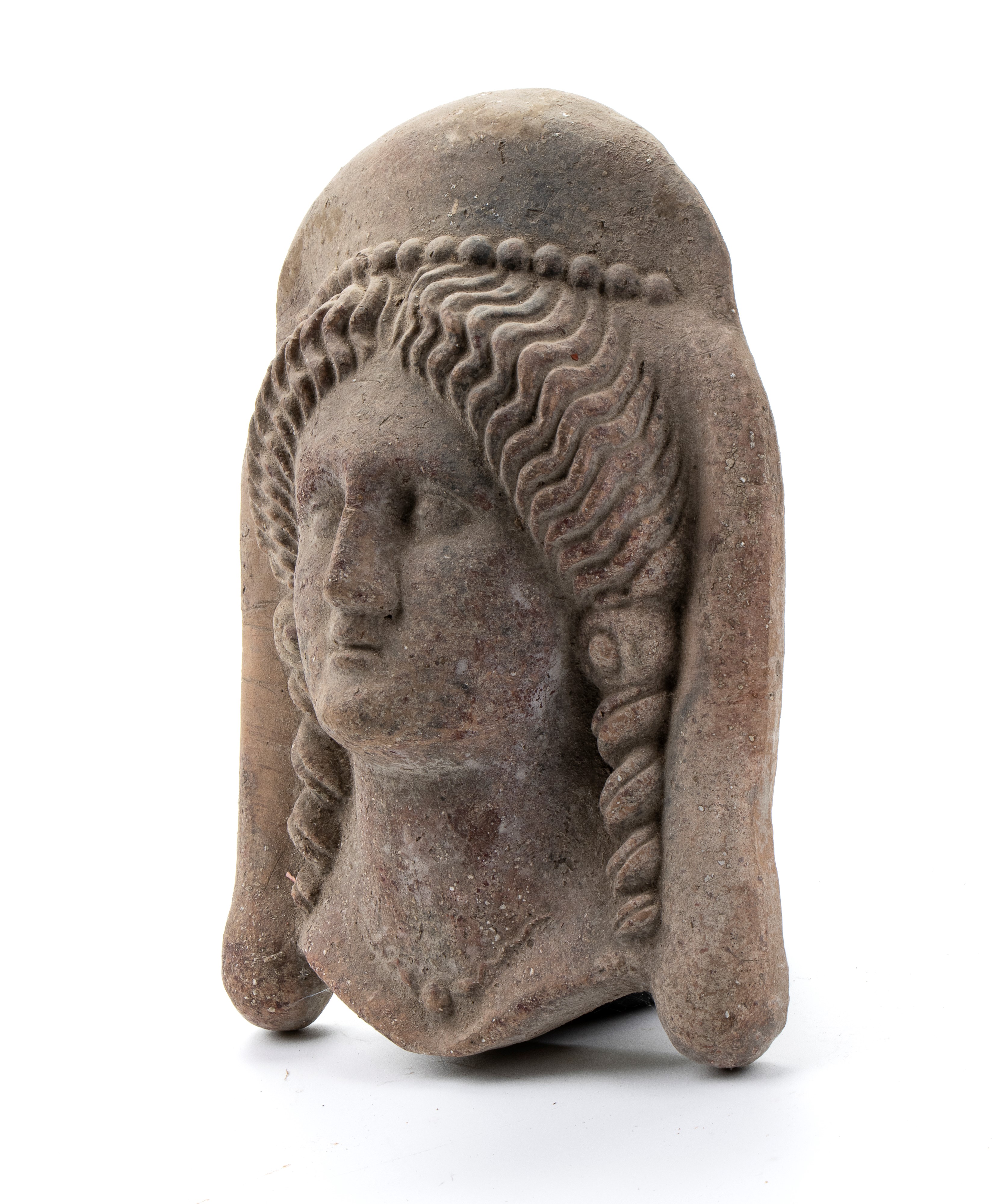 Antefissa in pietra raffigurante testa muliebre