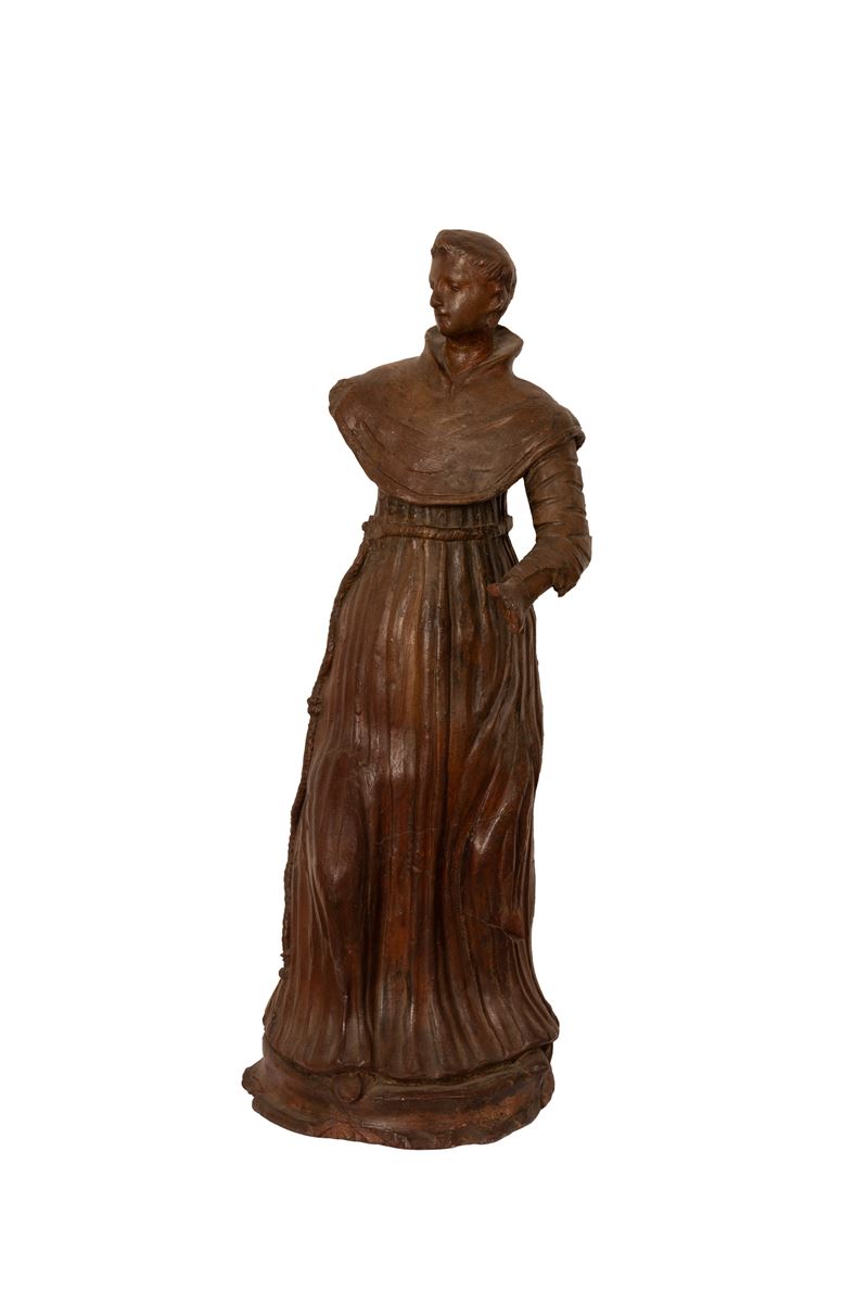 Scultura in terracotta cava e brunita ad imitazione del legno raffigurante un francescano.