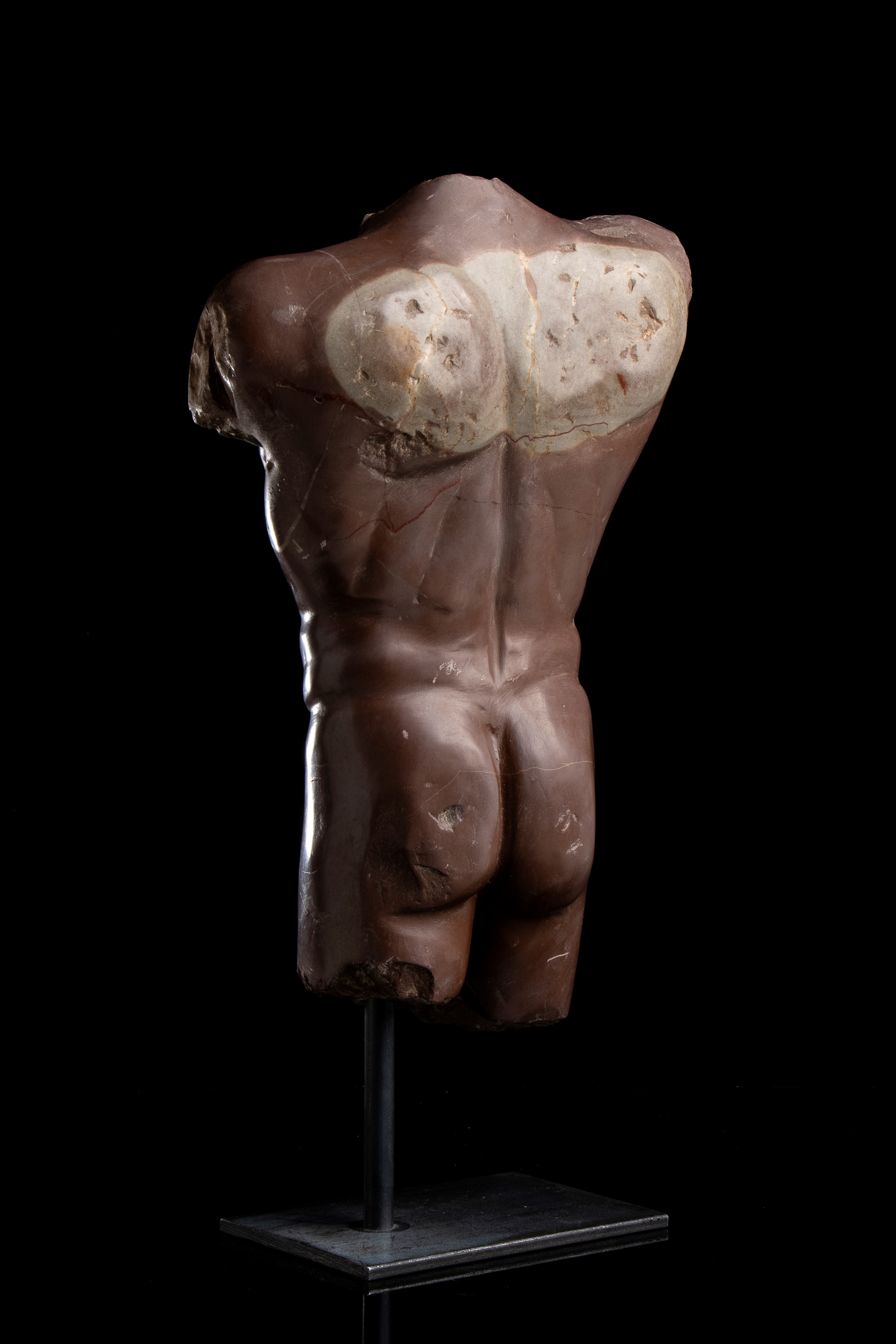 Torso in marmo rosso antico. Roma, fine del XIX - inizi del XX secolo