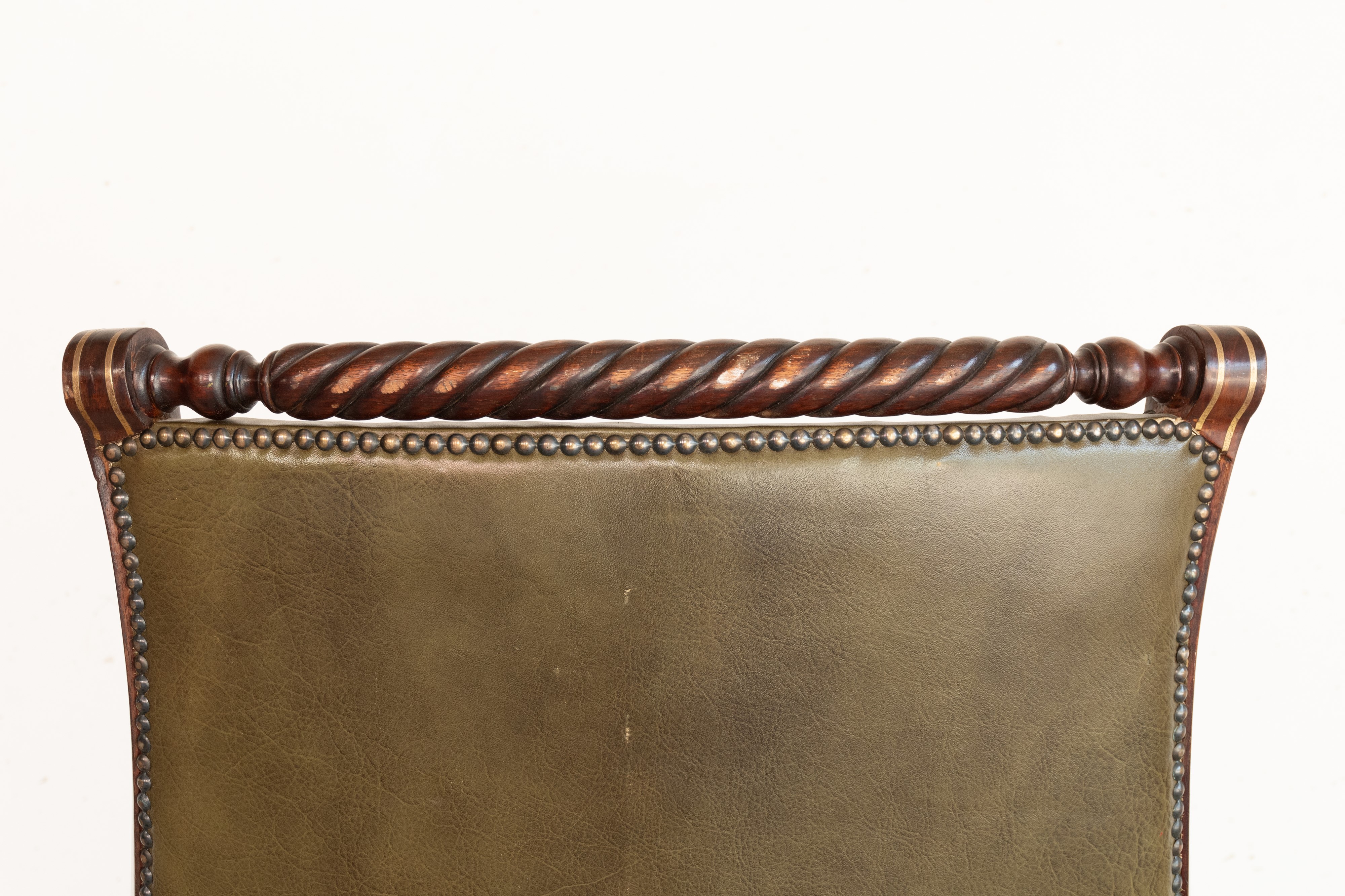 Poltrona Director in pelle verde. Inghilterra, inizi del XX secolo