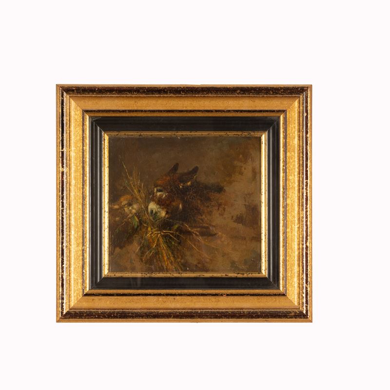 Asino e pecora che mangiano fieno