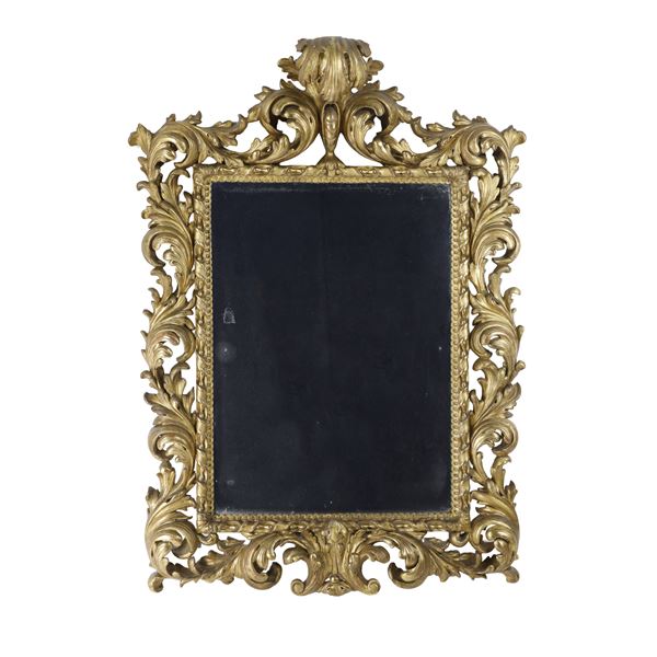 Grande specchiera a cartoccio. Emilia, inizi XIX secolo.