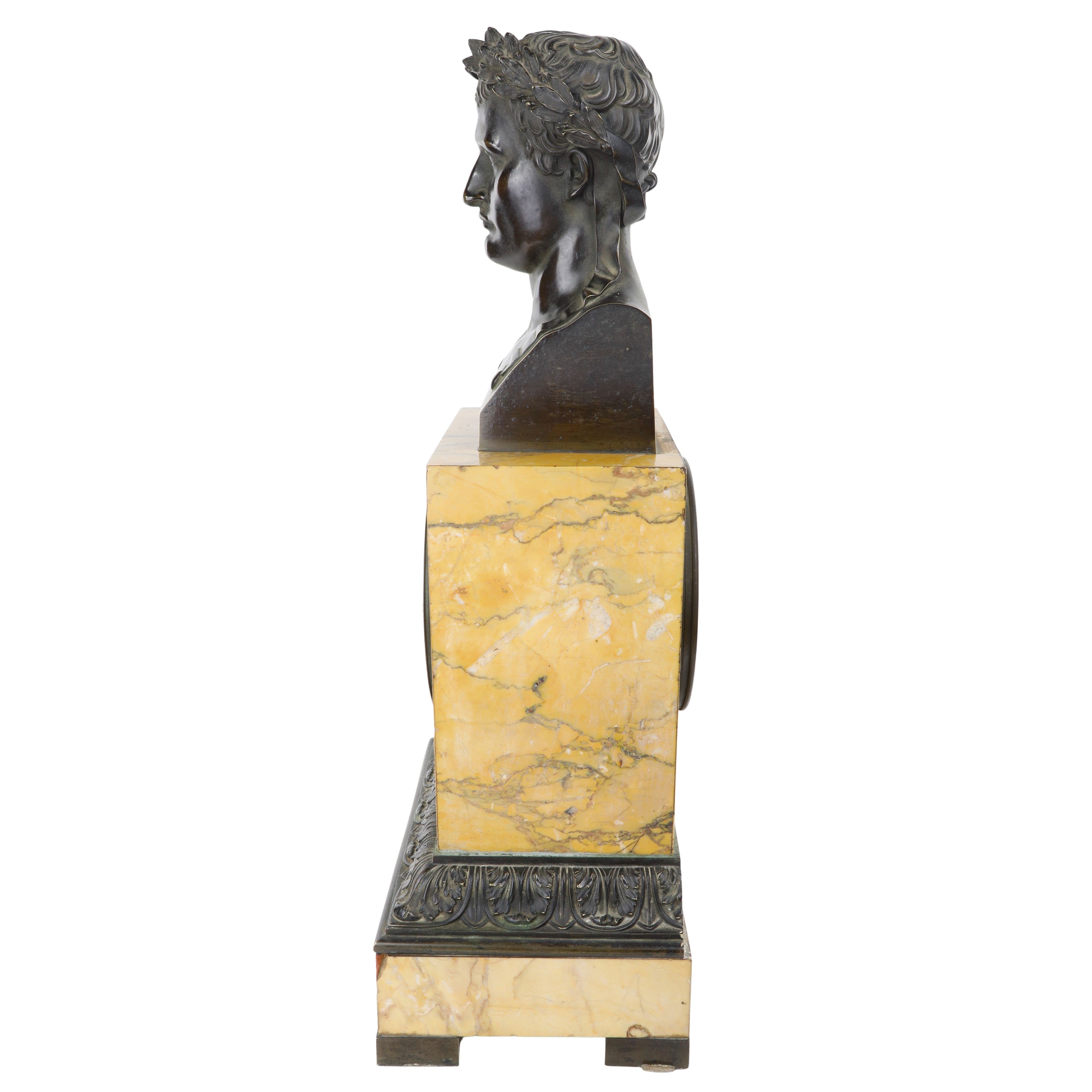 Orologio, scultura in bronzo su base in marmo giallo Siena