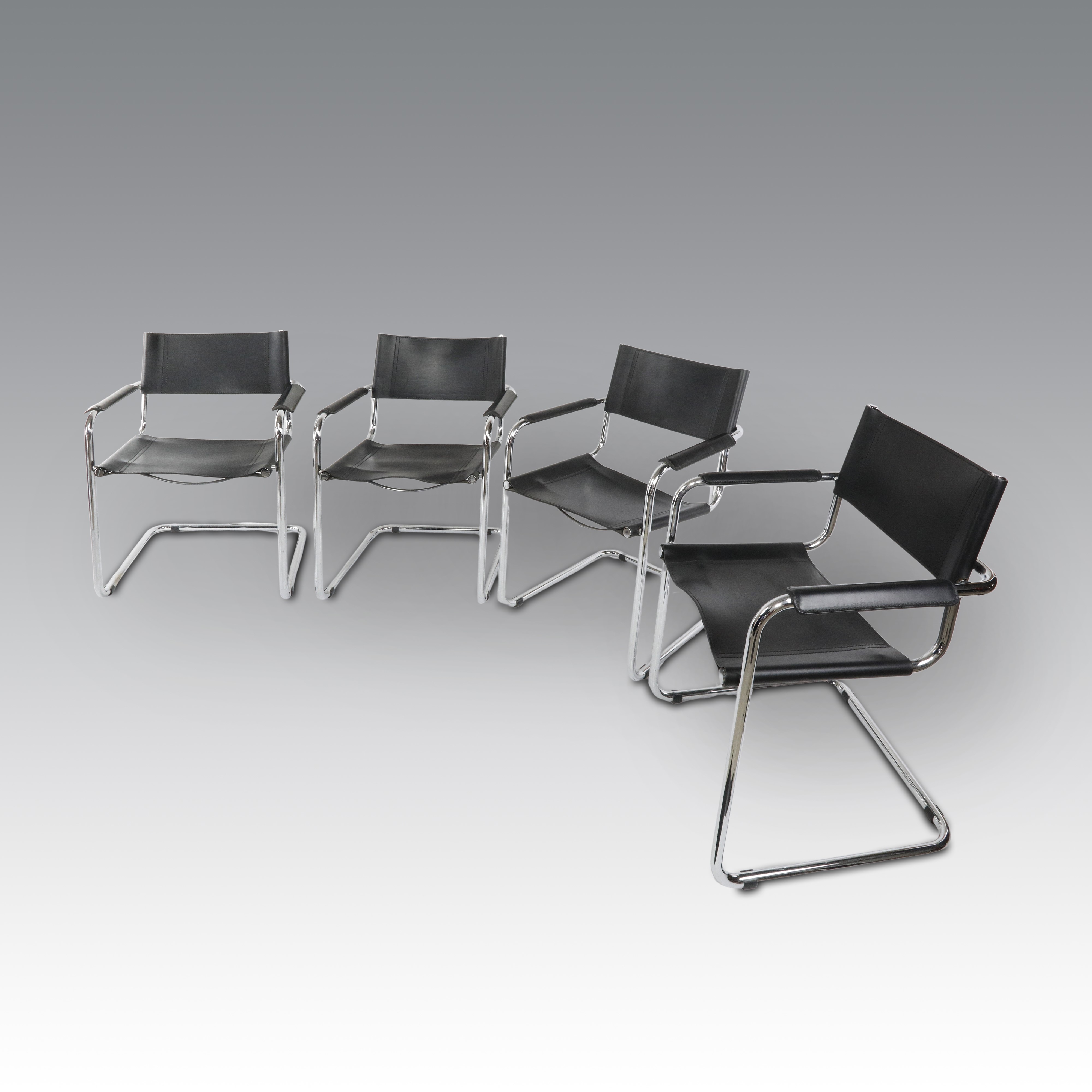Mart Stam per Thonet, Otto sedie in pelle, modello S34 con braccioli