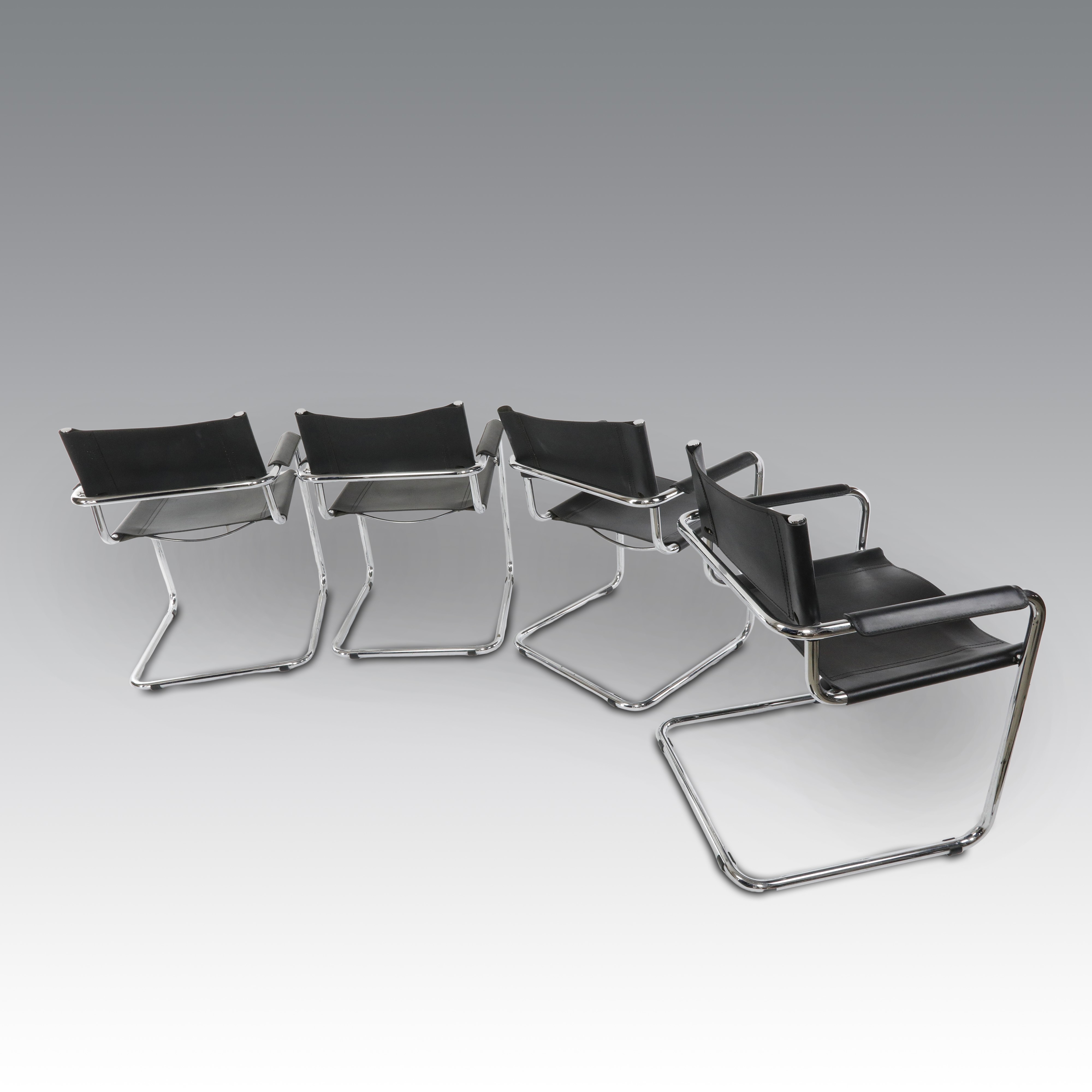 Mart Stam per Thonet, Otto sedie in pelle, modello S34 con braccioli