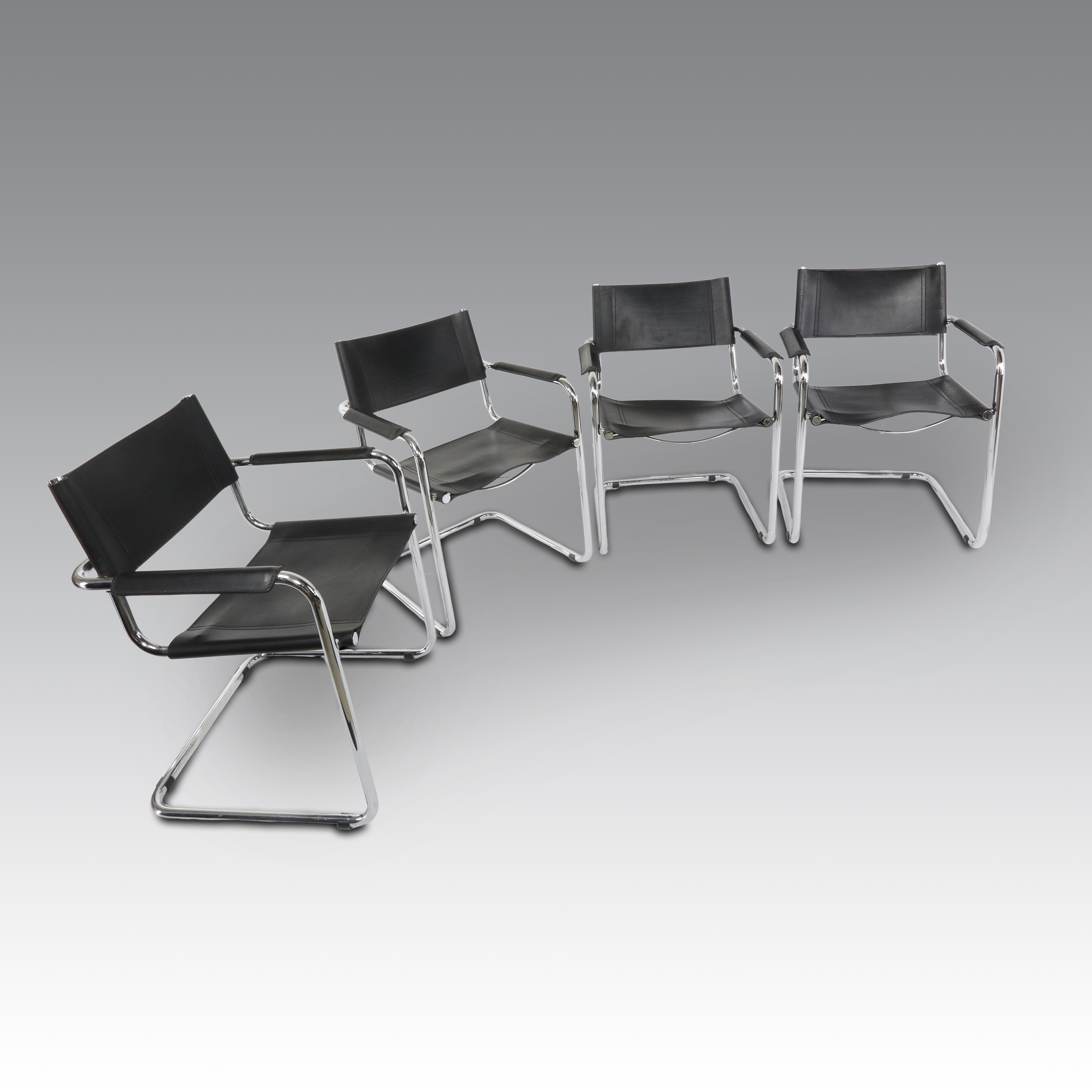 Mart Stam per Thonet, Otto sedie in pelle, modello S34 con braccioli