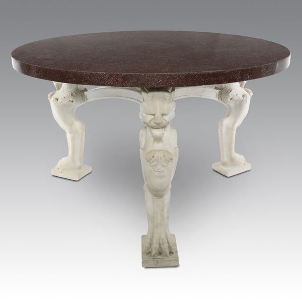 Celeste Dell'Anna - Tavolo tondo in porfido egiziano con gambe leonine in marmo di Carrara
