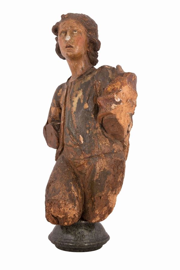 Scultura in legno dipinto raffigurante patrizio adorante