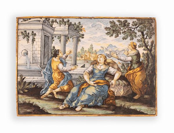 Manifattura Gentili, Castelli, met&#224; del XVIII secolo - Placca in maiolica policroma entro cornice ebanizzata e dorata, decorata con scena classica e figure, rovine e paesaggio con case sullo sfondo. 