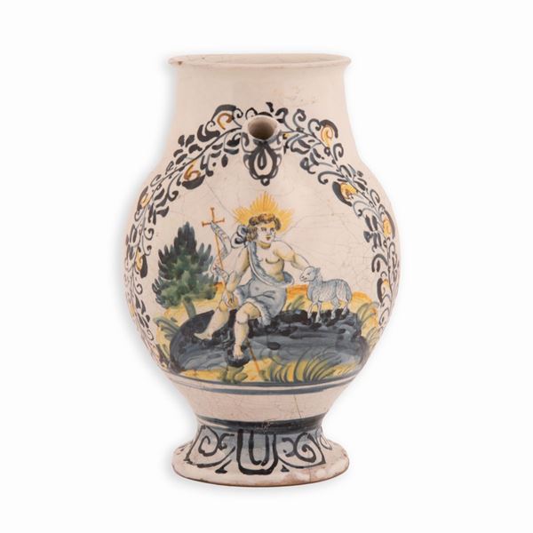 Manifattura castellana dei primi decenni del XVII secolo - Orciolo in maiolica decorato in policromia raffigurante San Giovannino seduto su una roccia con l'Agnello divino incorniciato da decorato fogliaceo. Bottega di Orazio Pompei o Nicola Truo.