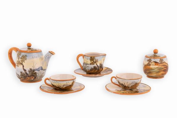 Manifattura Fuina, Giulianova inizi XX secolo - Servizio da caffè in maiolica decorato in policromia con paesaggi e case. 