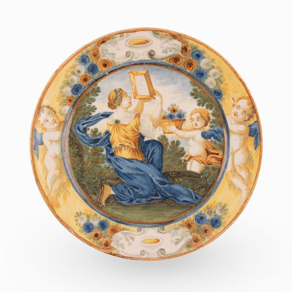 Castelli, bottega Gentile, met&#224; del XVIII secolo - Piattello in maiolica istoriato con scena mitologica (toletta di Venere)
