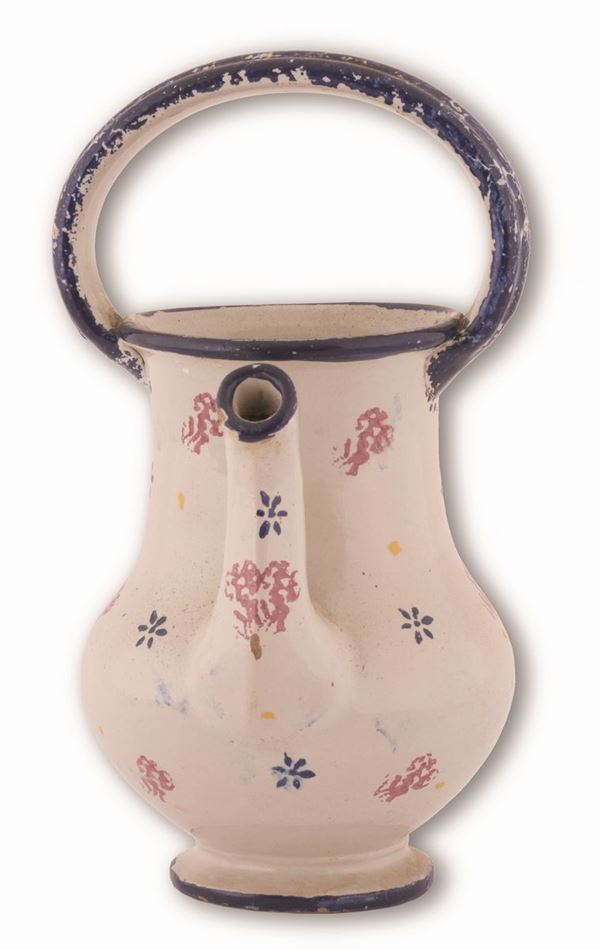 Manifattura abruzzese attiva tra il tardo XIX ed i primi del  XX secolo. - Brocchetta decorata con marezzature e fiori stilizzati sparsi
