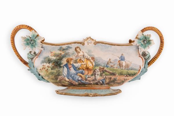 Fedele Cappelletti - Giardiniera in maiolica decorata con elementi fitomorfi a rilievo ed istoriata con una scena agreste di gusto neo rococò
