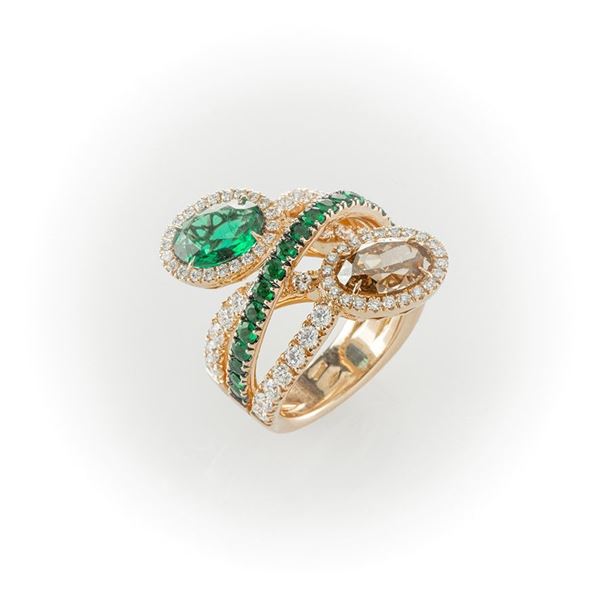 Rose gold ring with large emerald and large oval cut diamond, white and emerald diamonds