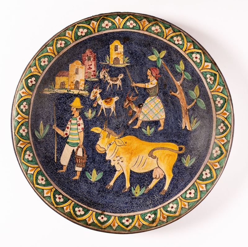 Grande piatto con mandriano con bue e pastora con capre. Manifattura Montelupo, metà del XX secol...
