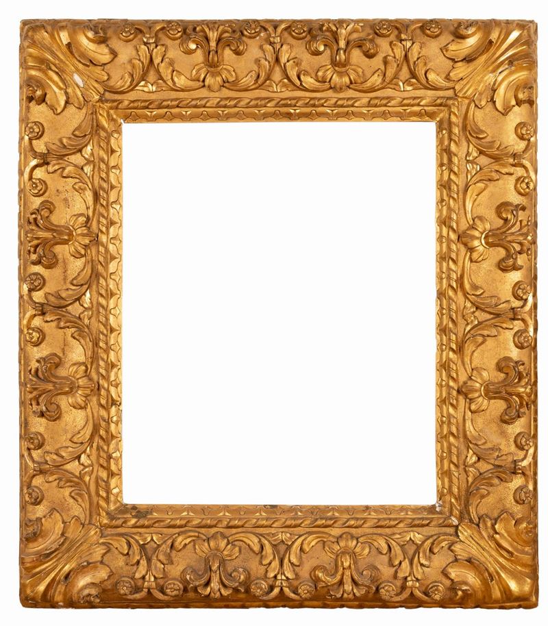 Grande cornice dorata a foglia oro. Manifattura emiliana del XVII secolo.