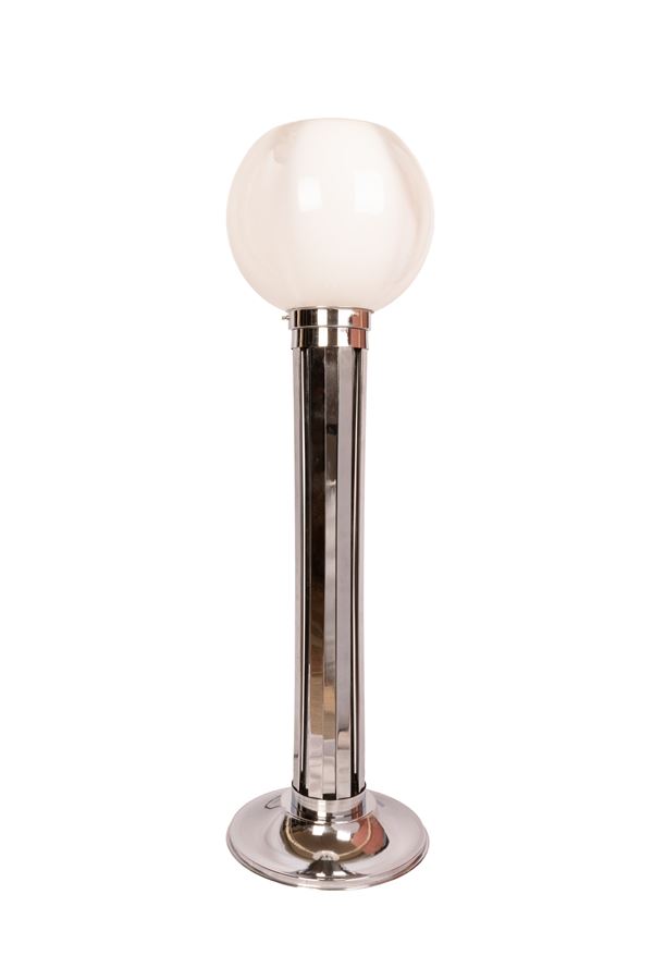 Floor lamp with blown glass diffuser, frame and steel base.