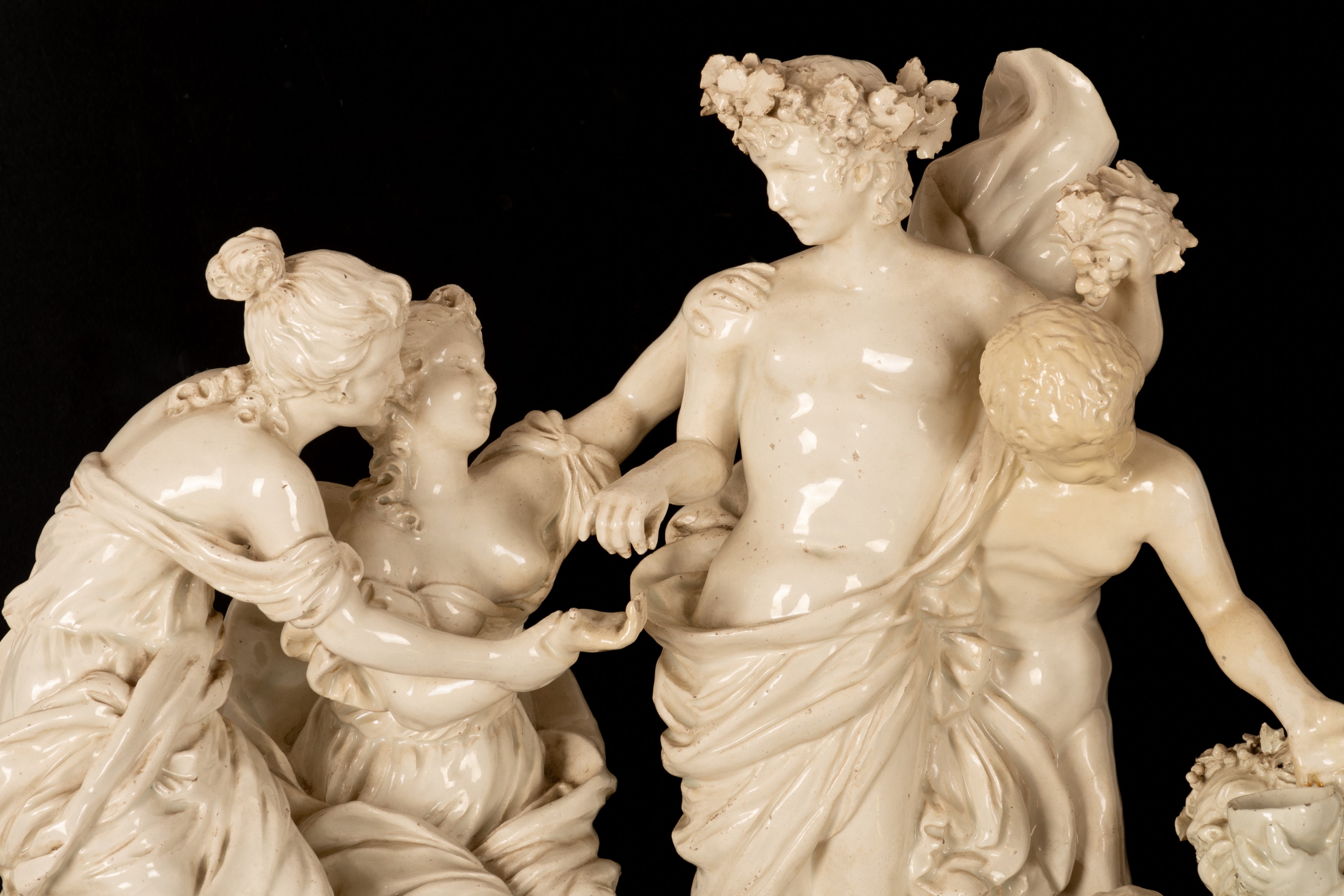 Gruppo scultoreo in terraglia raffigurante Bacco assistito dai satiri e da due menadi