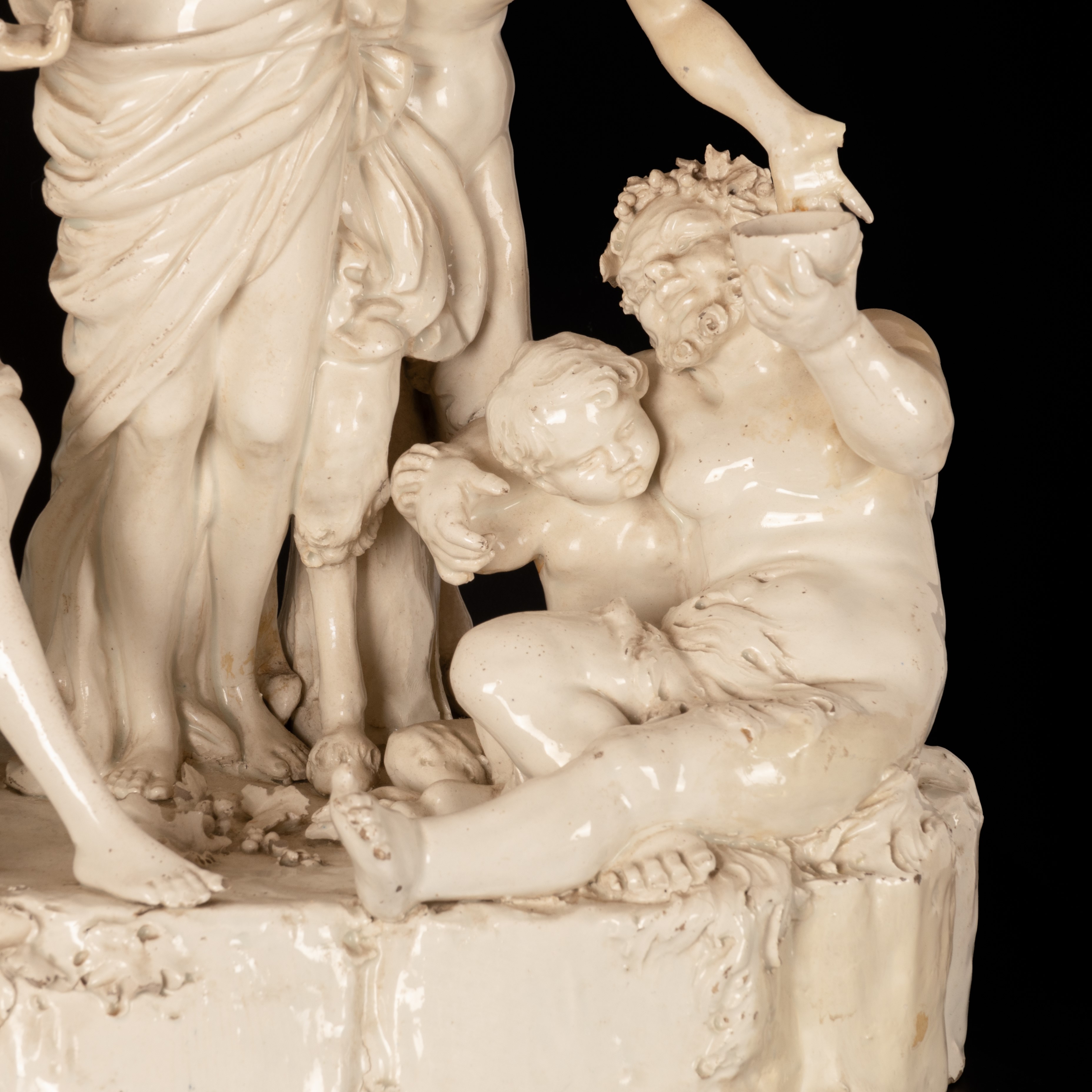 Gruppo scultoreo in terraglia raffigurante Bacco assistito dai satiri e da due menadi